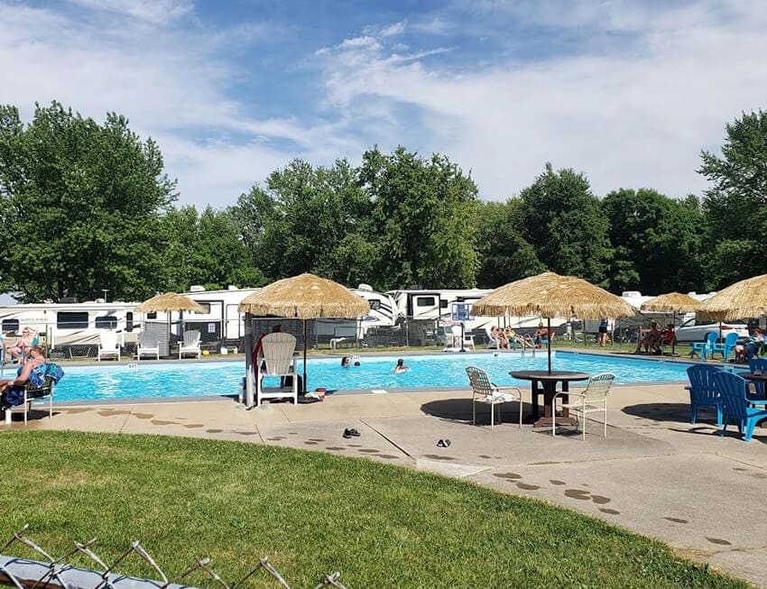 Pool at Gotta Getaway RV Park with umbrellas