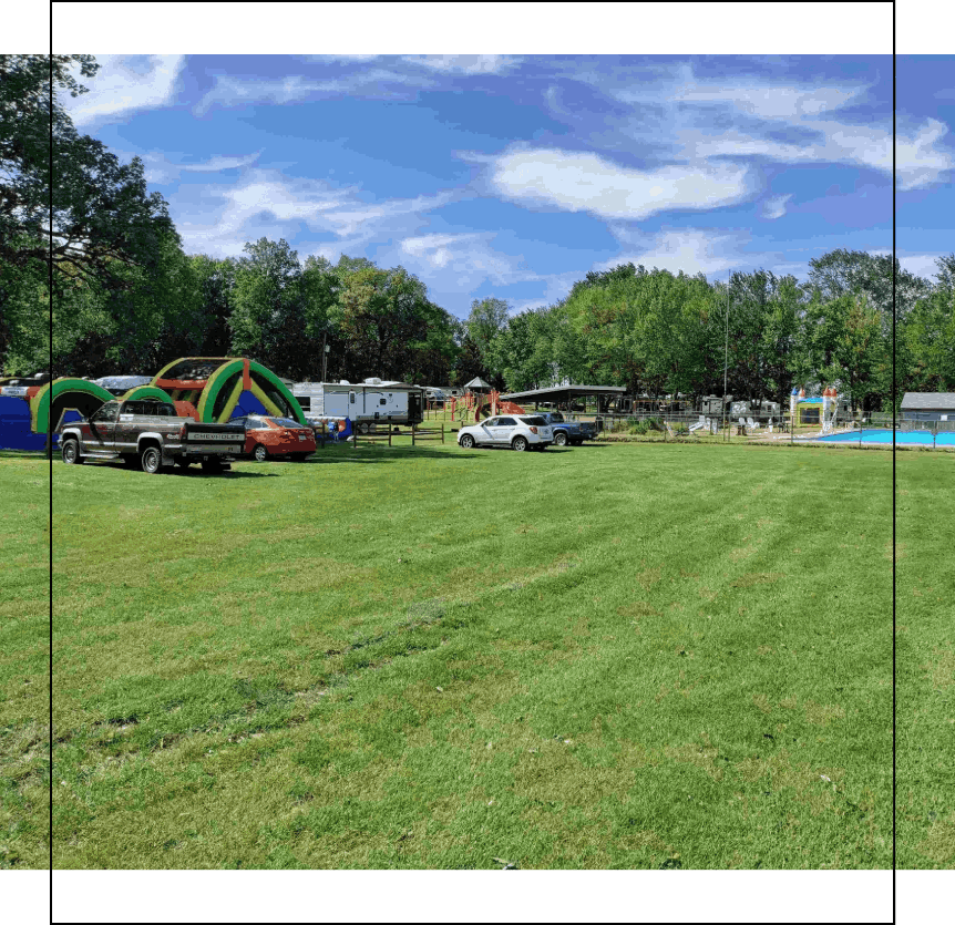 A grass visitors parking lot at gotta getaway rv park