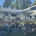 Guests watching the football game at their pull-thru RV site at Gotta Getaway RV Park