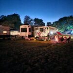 Gotta Getaway RV Park Grass Pull-Thru Site at night family camping